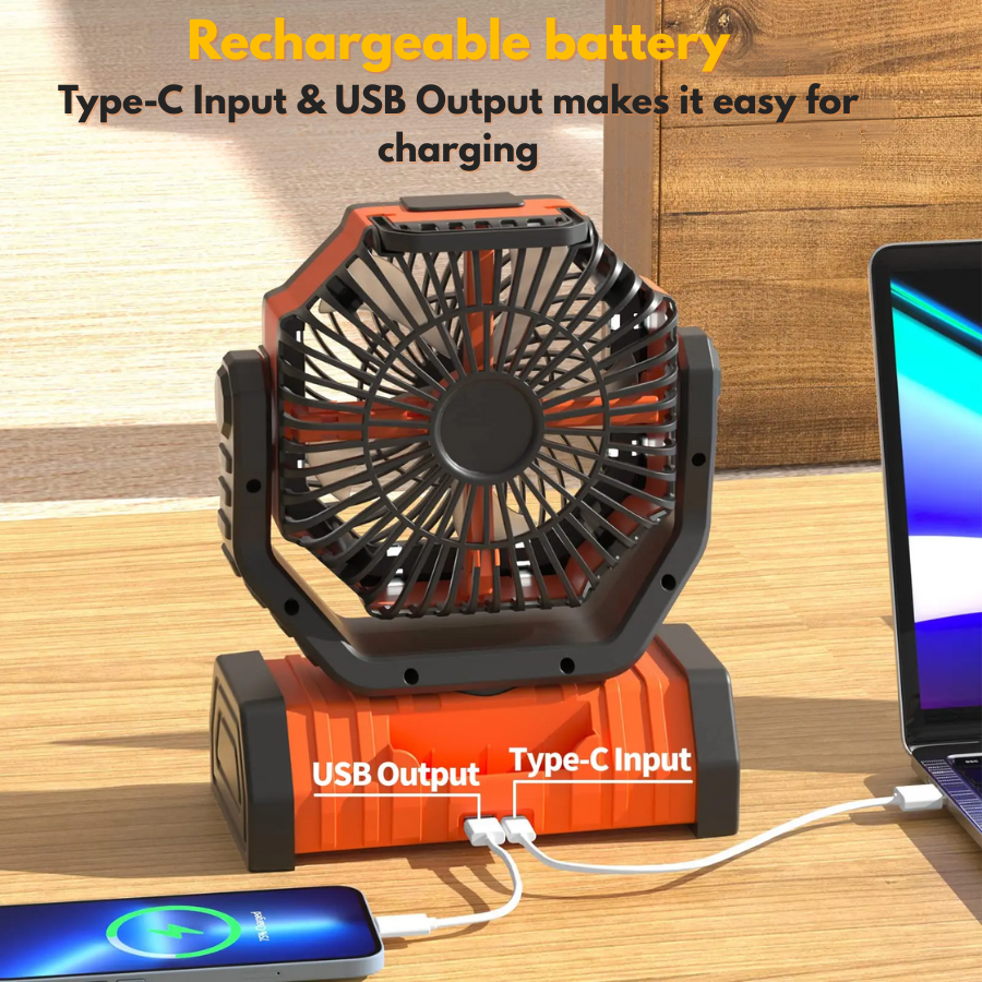Camping fan with USB output charging a phone