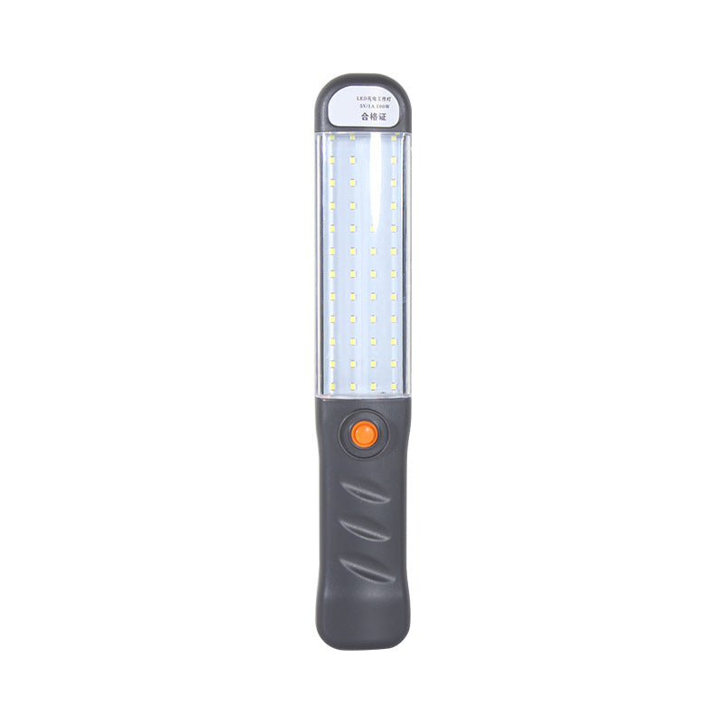 Grijze oplaadbare LED-werklamp met oranje aan-uitknop, rechtop